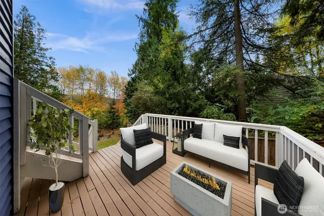 a balcony with wooden floor and fence