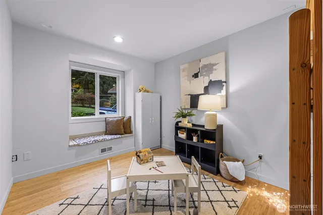 a living room with a fireplace furniture and a flat screen tv