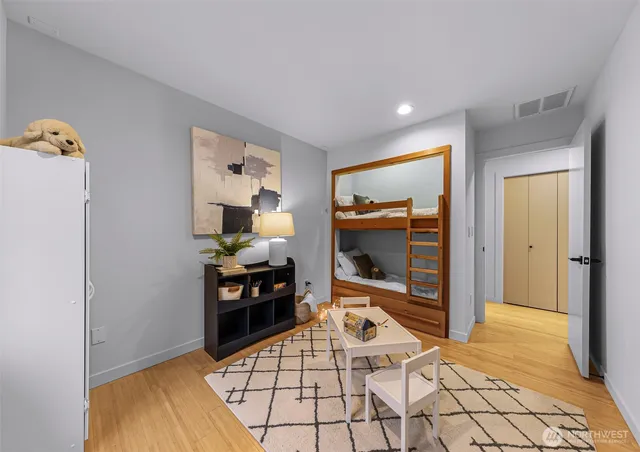 a living room with furniture and large windows