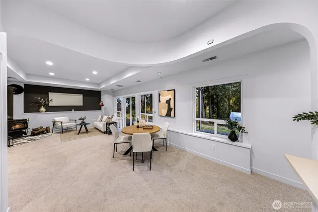 a dining room with furniture and window