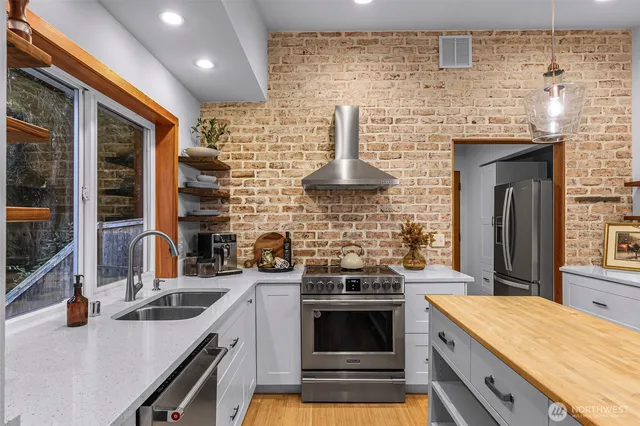 a kitchen with a stove and a sink
