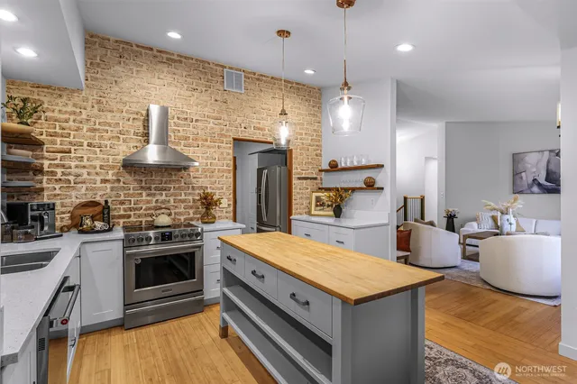 a kitchen with a stove and a kitchen island