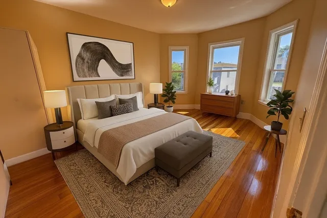 a bedroom with bed and a window