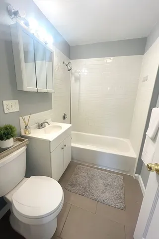 a bathroom with a toilet sink and bathtub