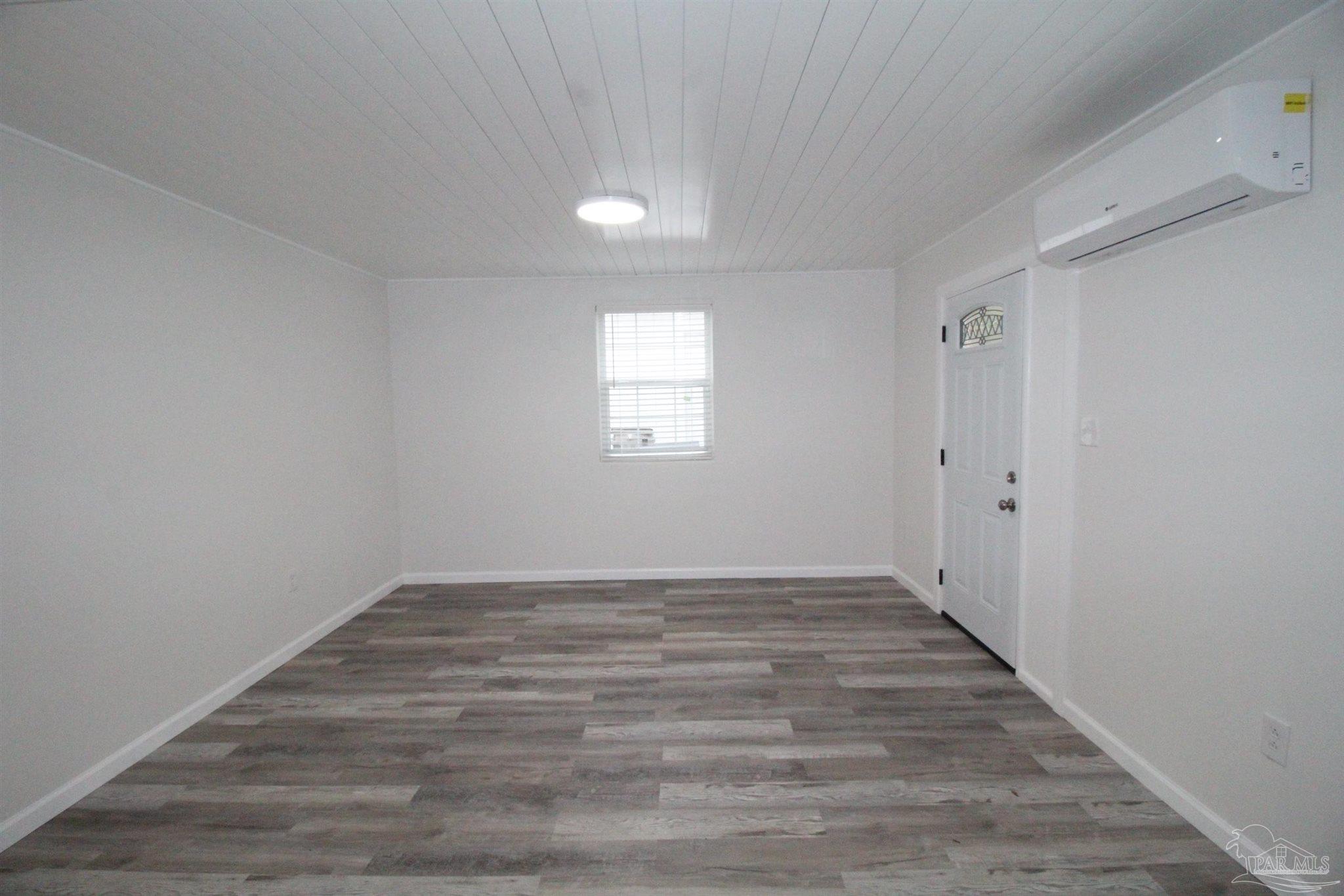 5523 Shell Street Pensacola, FL 32503 - Photo 3 of 11 wooden floor in an empty room