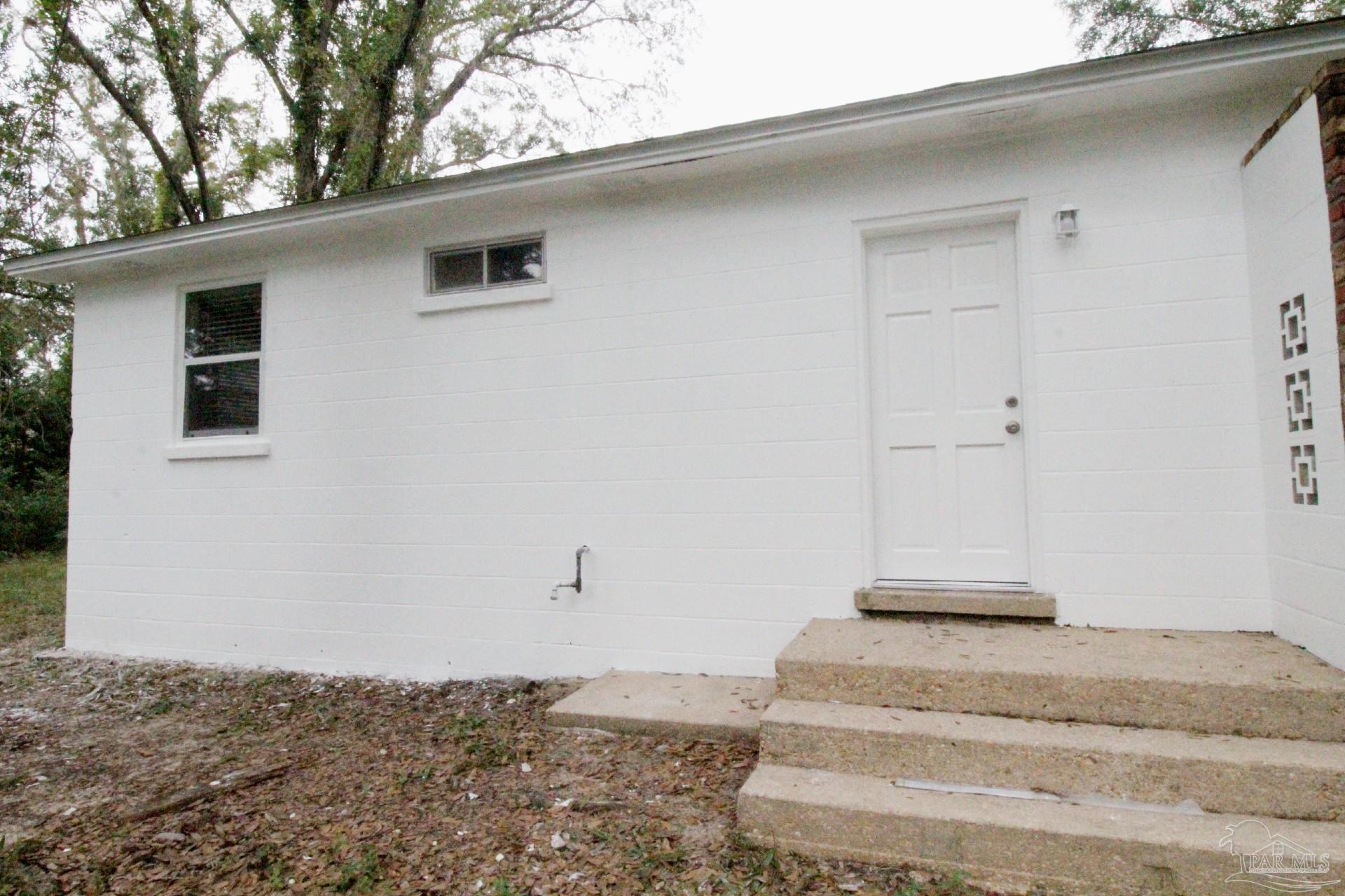 5523 Shell Street Pensacola, FL 32503 - Photo 10 of 11 a view of a house with a yard