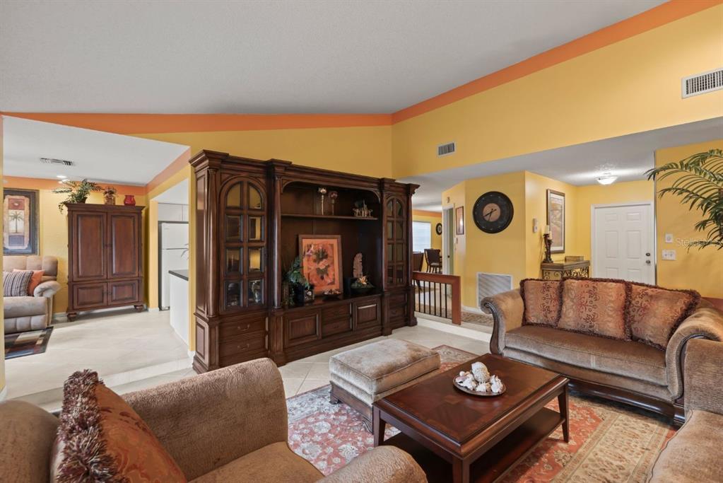 10618 180th Place South Boca Raton, FL 33498 - Photo 11 of 45 a living room with furniture and a fireplace