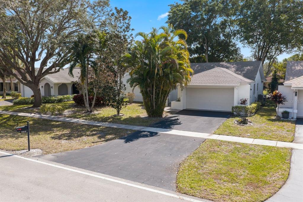 10618 180th Place South Boca Raton, FL 33498 - Photo 2 of 45 a view of backyard of the house
