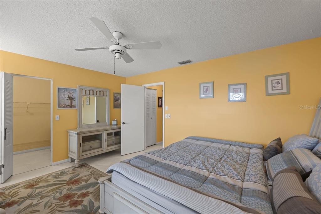 10618 180th Place South Boca Raton, FL 33498 - Photo 23 of 45 a bedroom with a bed dresser and a window