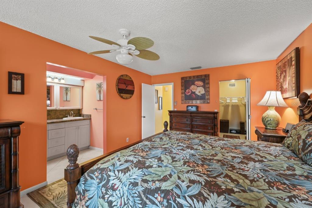10618 180th Place South Boca Raton, FL 33498 - Photo 25 of 45 a bedroom with a bed and wooden floor