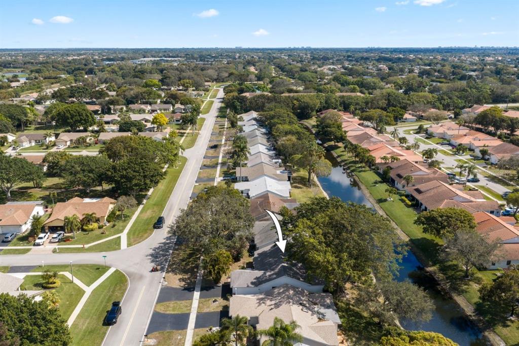 10618 180th Place South Boca Raton, FL 33498 - Photo 41 of 45 an aerial view of residential houses with outdoor space and trees
