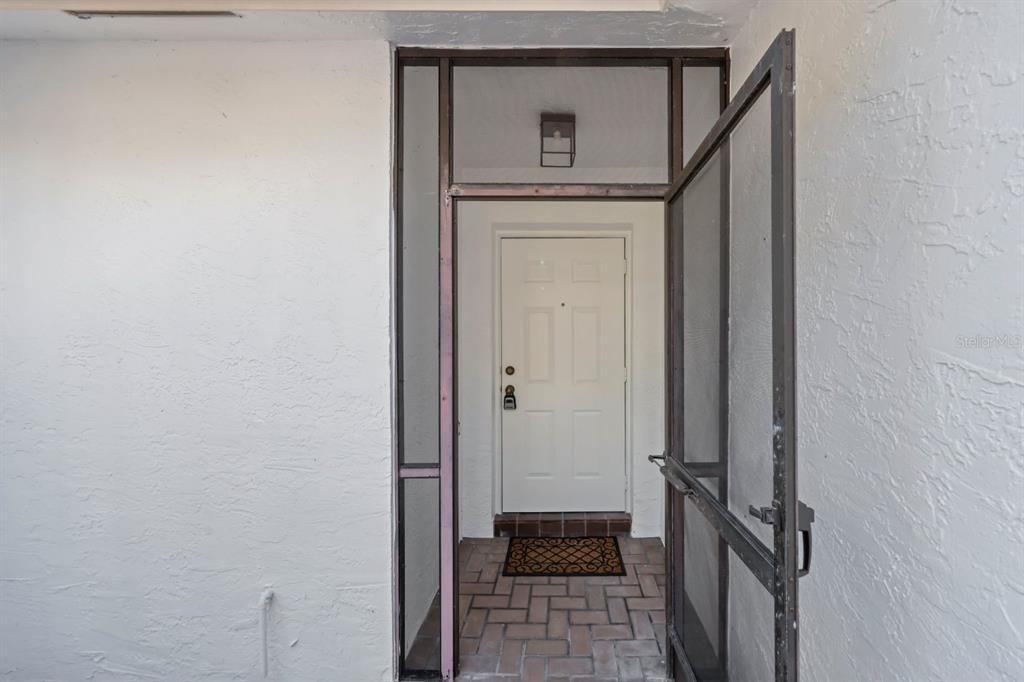10618 180th Place South Boca Raton, FL 33498 - Photo 5 of 45 a view of a hallway with wooden floor and entryway