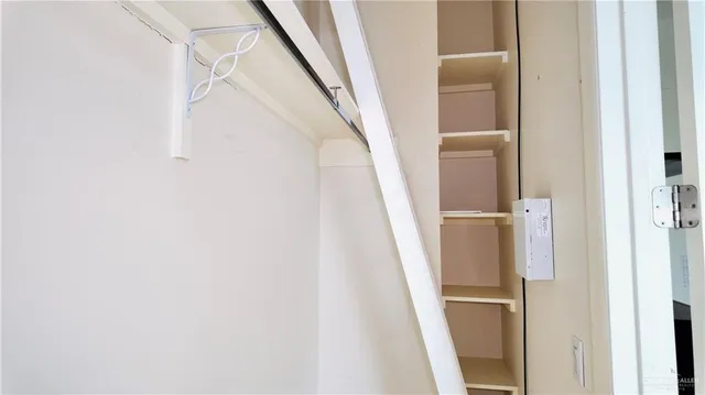 a living room with furniture and a mirror