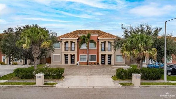 front view of a house with a garden