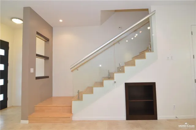 a view of kitchen and kitchen with stainless steel appliances