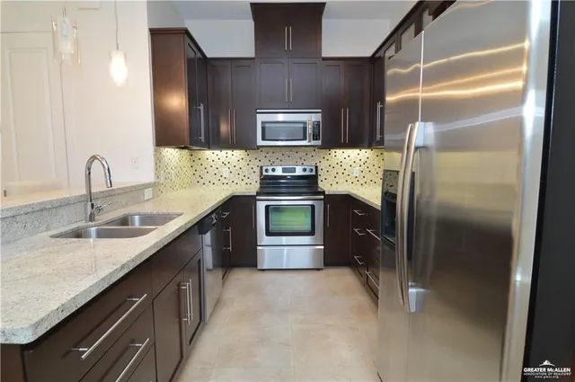 a view of a chandelier fan and entryway