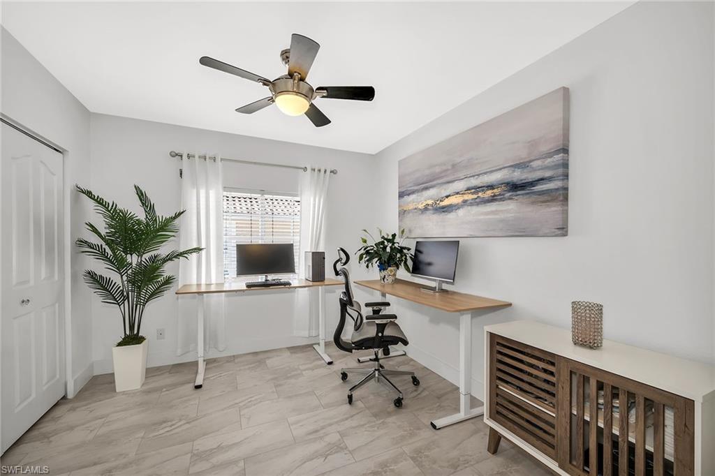 1747 Reuven Circle, Unit 4 Naples, FL 34112 - Photo 23 of 46 a view of a workspace with furniture and a window