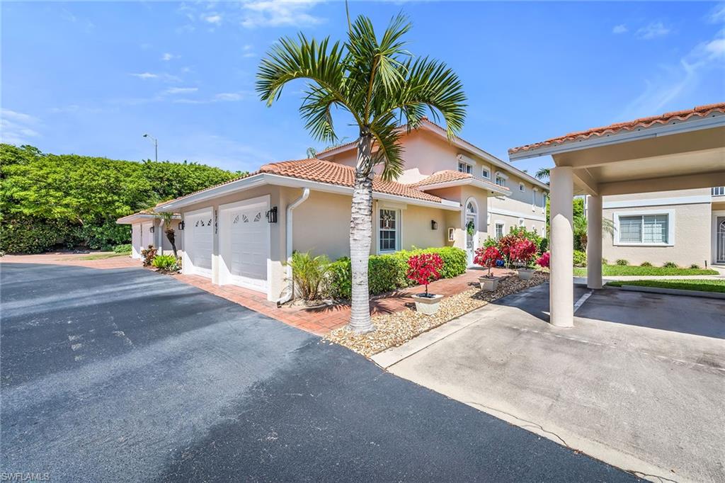 1747 Reuven Circle, Unit 4 Naples, FL 34112 - Photo 34 of 46 a view of a house with a street