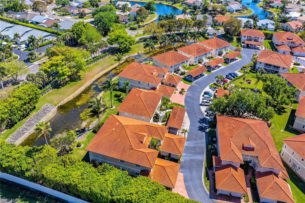 1747 Reuven Circle, Unit 4 Naples, FL 34112 - Photo 37 of 46 an aerial view of residential houses with outdoor space