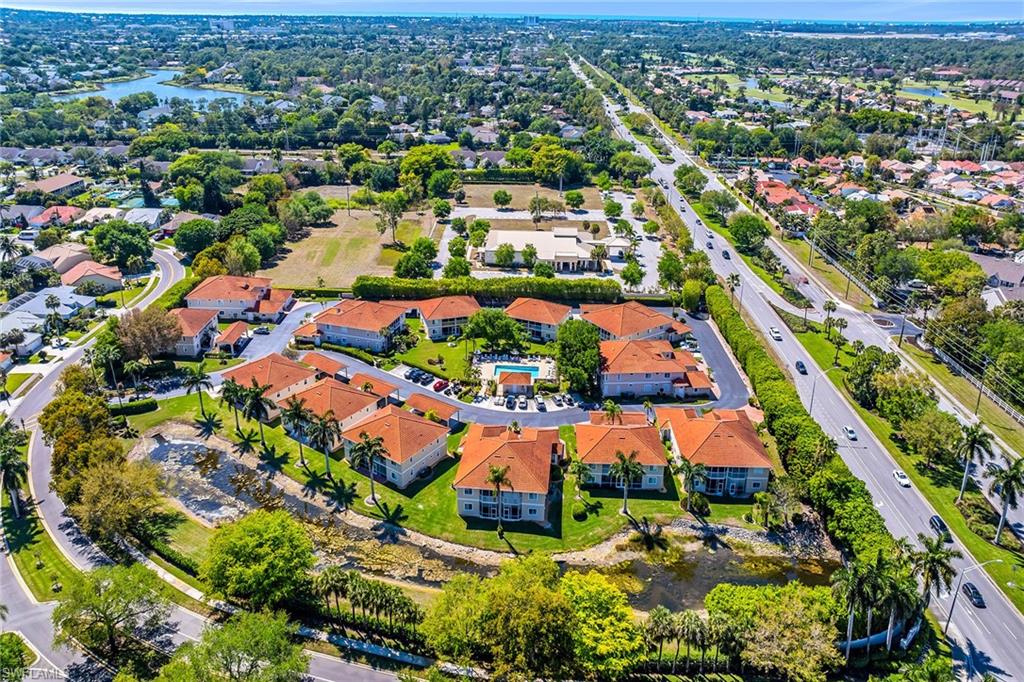 1747 Reuven Circle, Unit 4 Naples, FL 34112 - Photo 38 of 46 an aerial view of residential houses with outdoor space