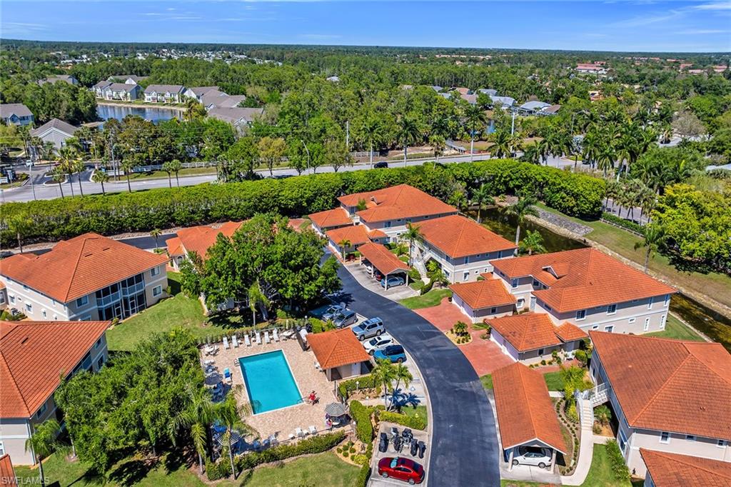 1747 Reuven Circle, Unit 4 Naples, FL 34112 - Photo 39 of 46 an aerial view of residential houses with outdoor space and street view