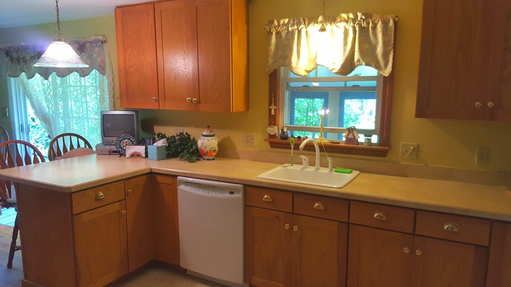 7 Pompano Road Worcester, MA 01605 - Photo 10 of 29 a kitchen with a sink cabinets and window