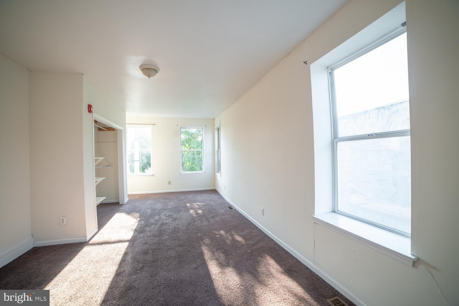 a view of hallway with windows