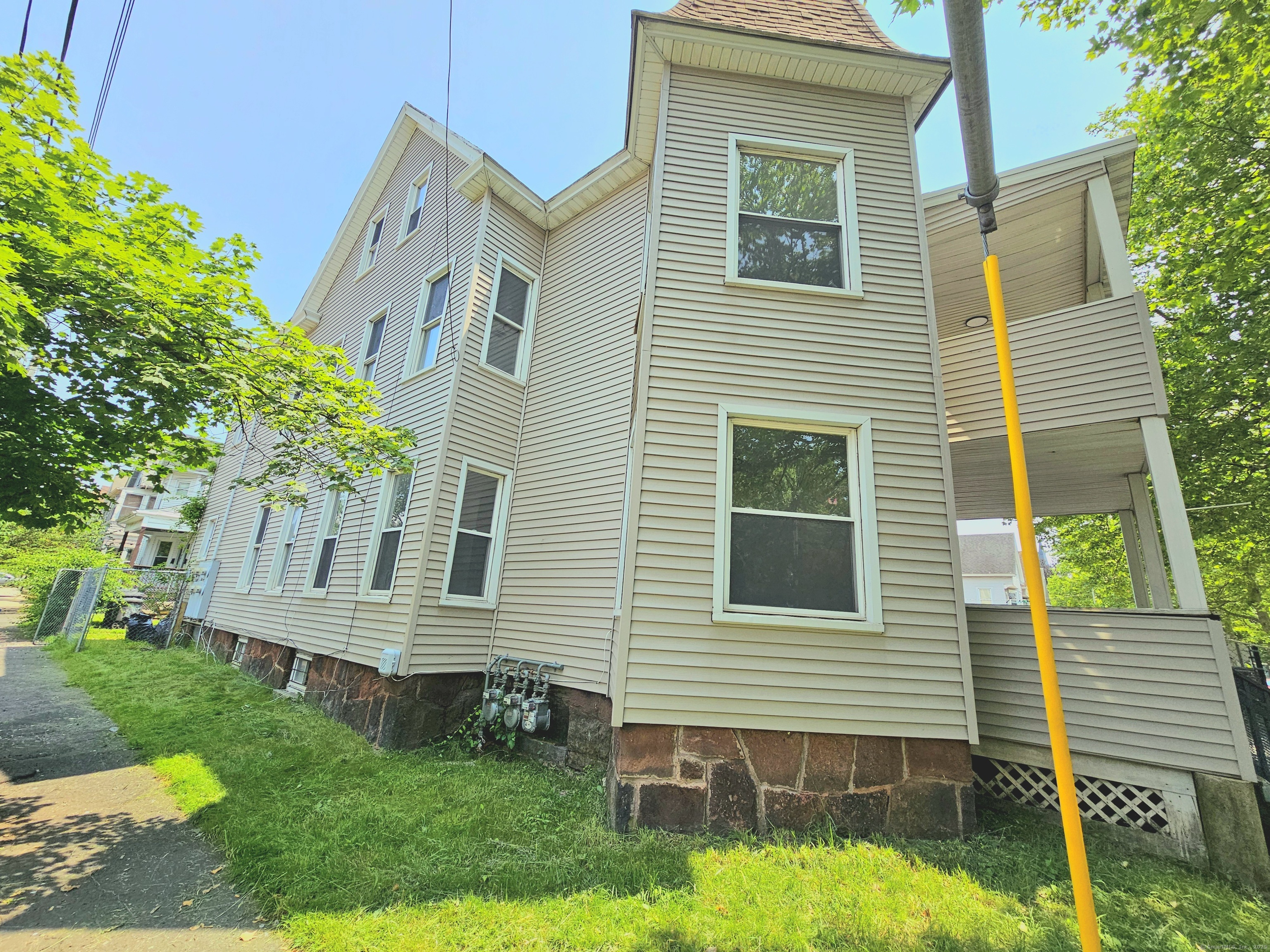 483 Ferry Street, Unit 3 New Haven, CT 06513 - Photo 2 of 10 a view of a house with a yard