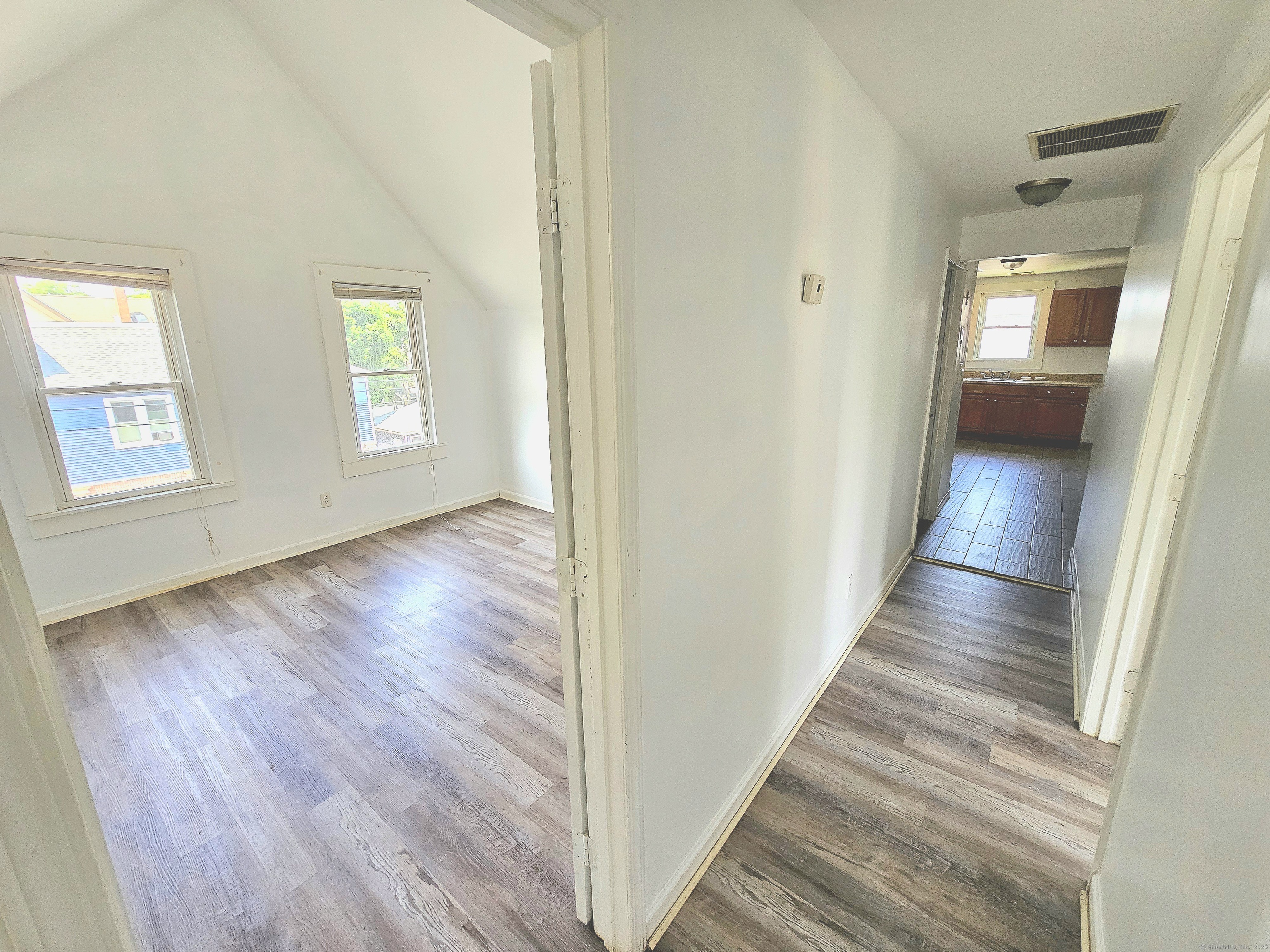 483 Ferry Street, Unit 3 New Haven, CT 06513 - Photo 6 of 10 wooden floor in an empty room with a window