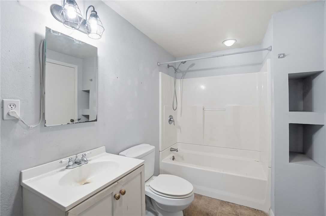 1166 West Sparrow Road Springfield, OH 45502 - Photo 27 of 40 Functional bathroom with shower-tub combo and vanity.