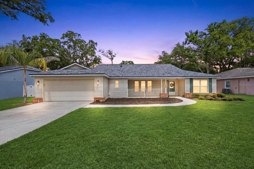 a front view of a house with a yard