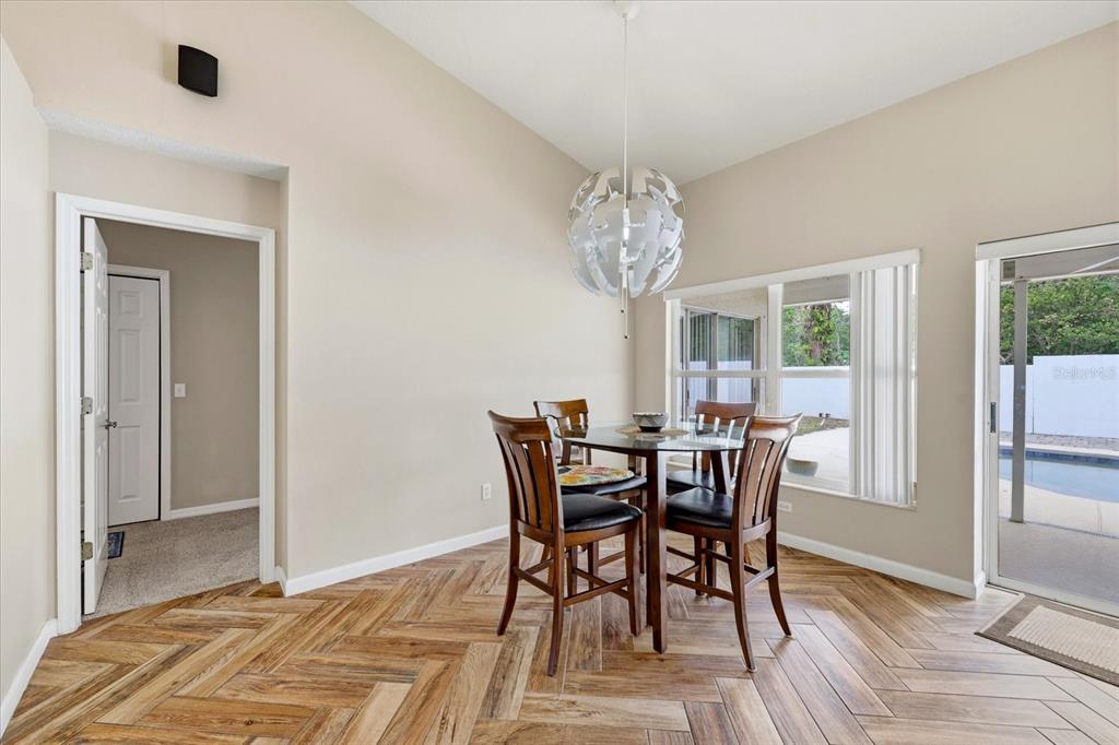 224 Bryan Oak Avenue Brandon, FL 33511 - Photo 11 of 33 a view of a dining room with furniture window and wooden floor