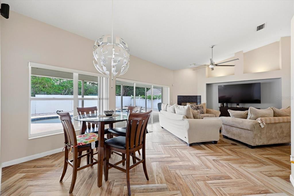 224 Bryan Oak Avenue Brandon, FL 33511 - Photo 12 of 33 a view of a dining room with furniture window and wooden floor