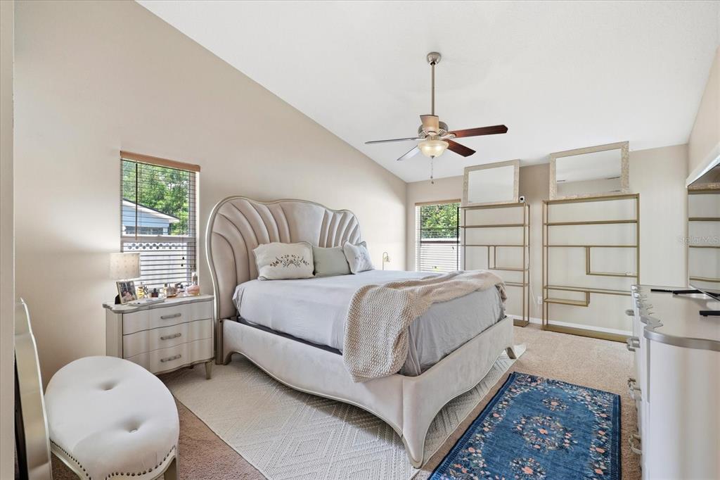 224 Bryan Oak Avenue Brandon, FL 33511 - Photo 20 of 33 a bedroom with a large bed and a chandelier