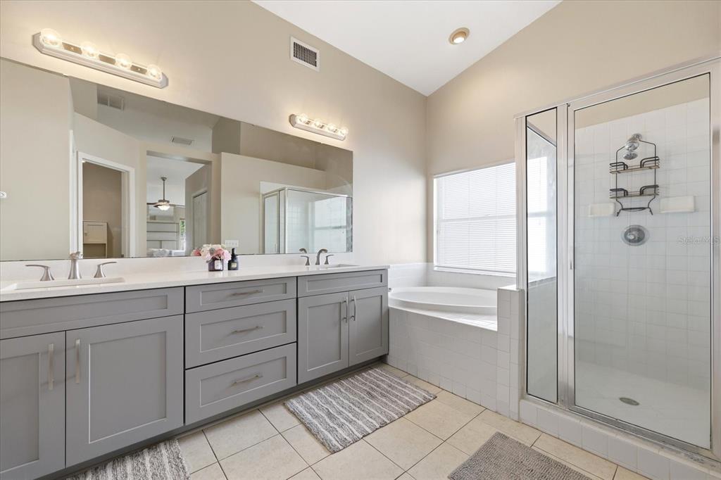 224 Bryan Oak Avenue Brandon, FL 33511 - Photo 24 of 33 a bathroom with a granite countertop sink mirror and shower