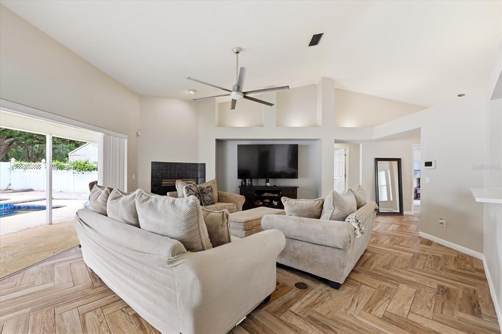 224 Bryan Oak Avenue Brandon, FL 33511 - Photo 3 of 33 a living room with furniture a large window and a flat screen tv
