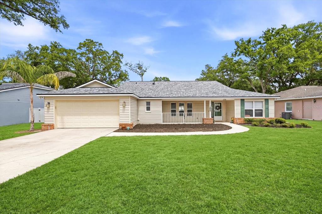 224 Bryan Oak Avenue Brandon, FL 33511 - Photo 31 of 33 a front view of a house with a garden and porch