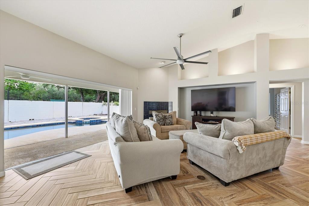 224 Bryan Oak Avenue Brandon, FL 33511 - Photo 4 of 33 a living room with furniture a ceiling fan and a flat screen tv