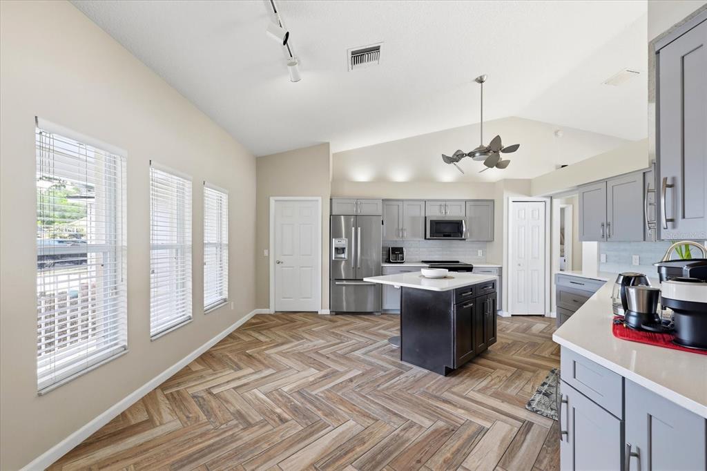 224 Bryan Oak Avenue Brandon, FL 33511 - Photo 6 of 33 a kitchen with a stove and a refrigerator