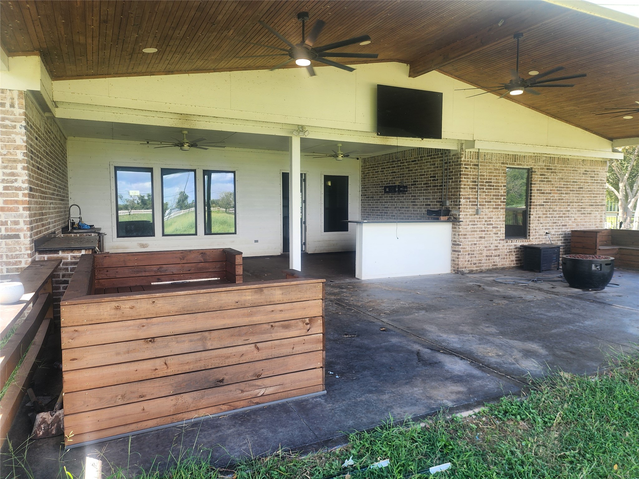 214 Lakeland Circle Rosharon, TX 77583 - Photo 29 of 34 a view of living room that has a couch and a fireplace with a large window