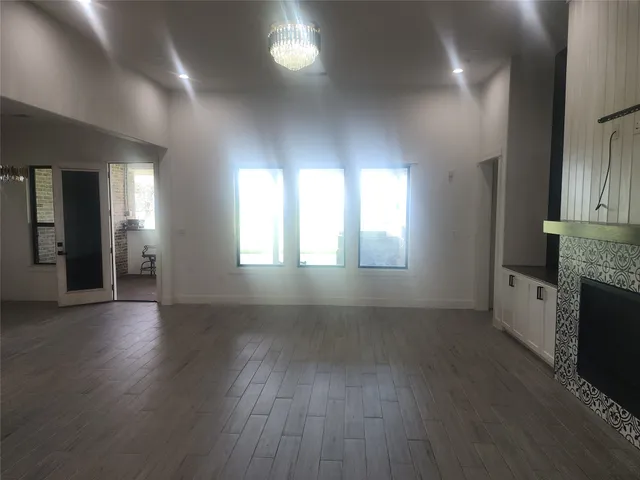 a bathroom with a granite countertop double vanity sink and mirror