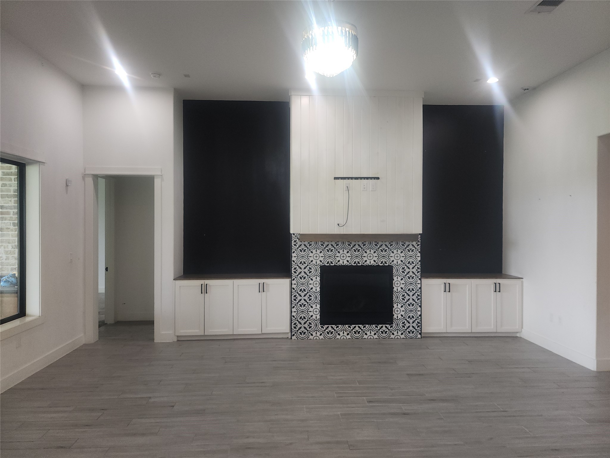 214 Lakeland Circle Rosharon, TX 77583 - Photo 6 of 34 a living room with a fireplace and a flat screen tv