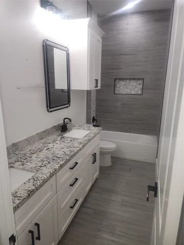 a view of a room with wooden floor and staircase