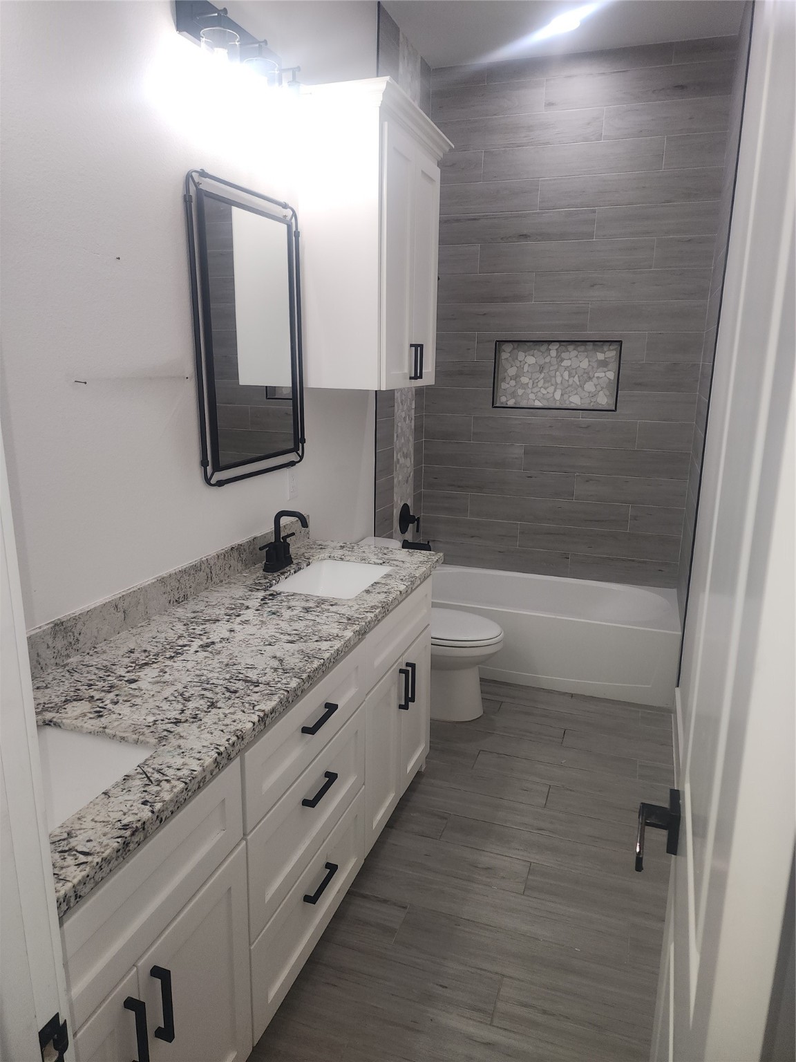 214 Lakeland Circle Rosharon, TX 77583 - Photo 8 of 34 a bathroom with a granite countertop double vanity sink and mirror