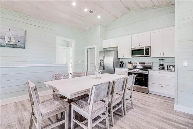 a view of a balcony with wooden floor