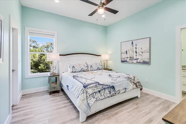 a bathroom with a granite countertop sink a toilet and a shower