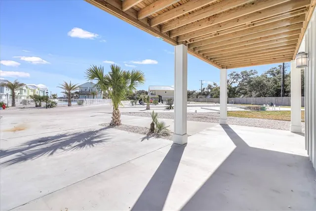 a view of a hallway with entryway and stairs