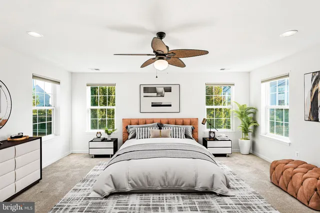 a spacious bedroom with a large bed and a window