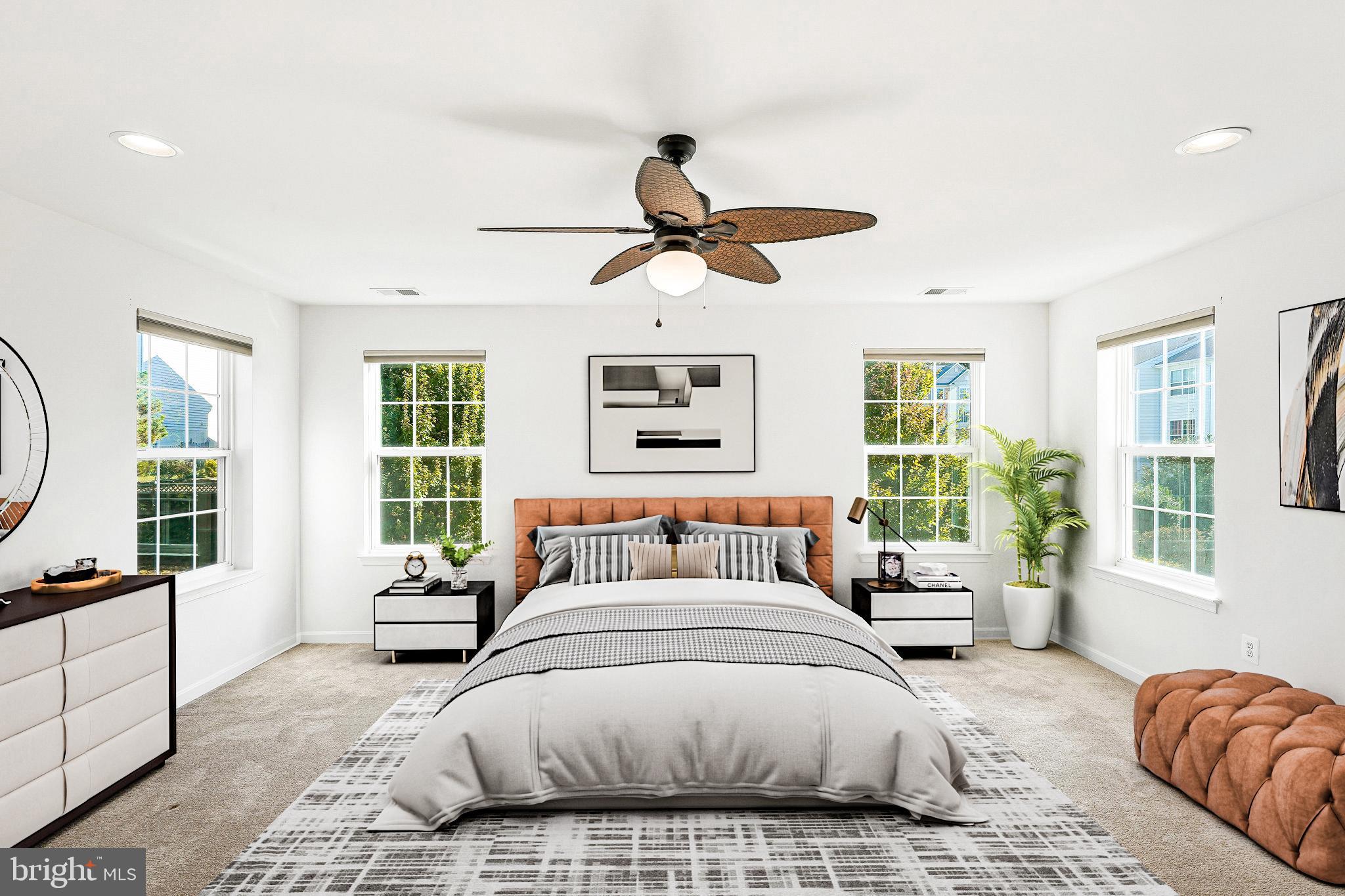 16012 Imperial Eagle Court Woodbridge, VA 22191 - Photo 12 of 25 a spacious bedroom with a large bed and a window