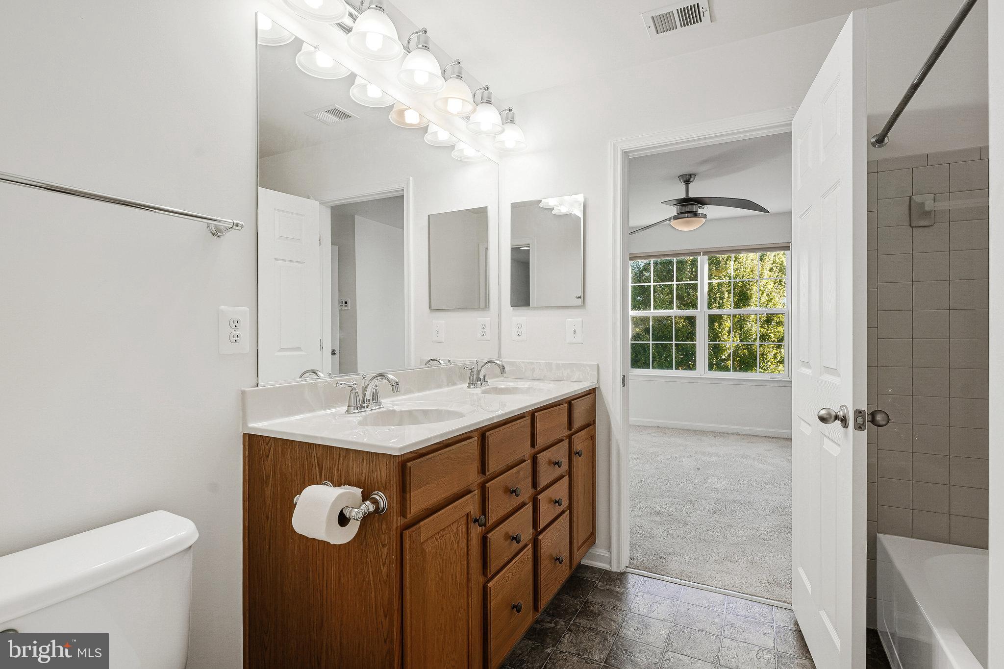 16012 Imperial Eagle Court Woodbridge, VA 22191 - Photo 17 of 25 a bathroom with a sink a toilet and shower